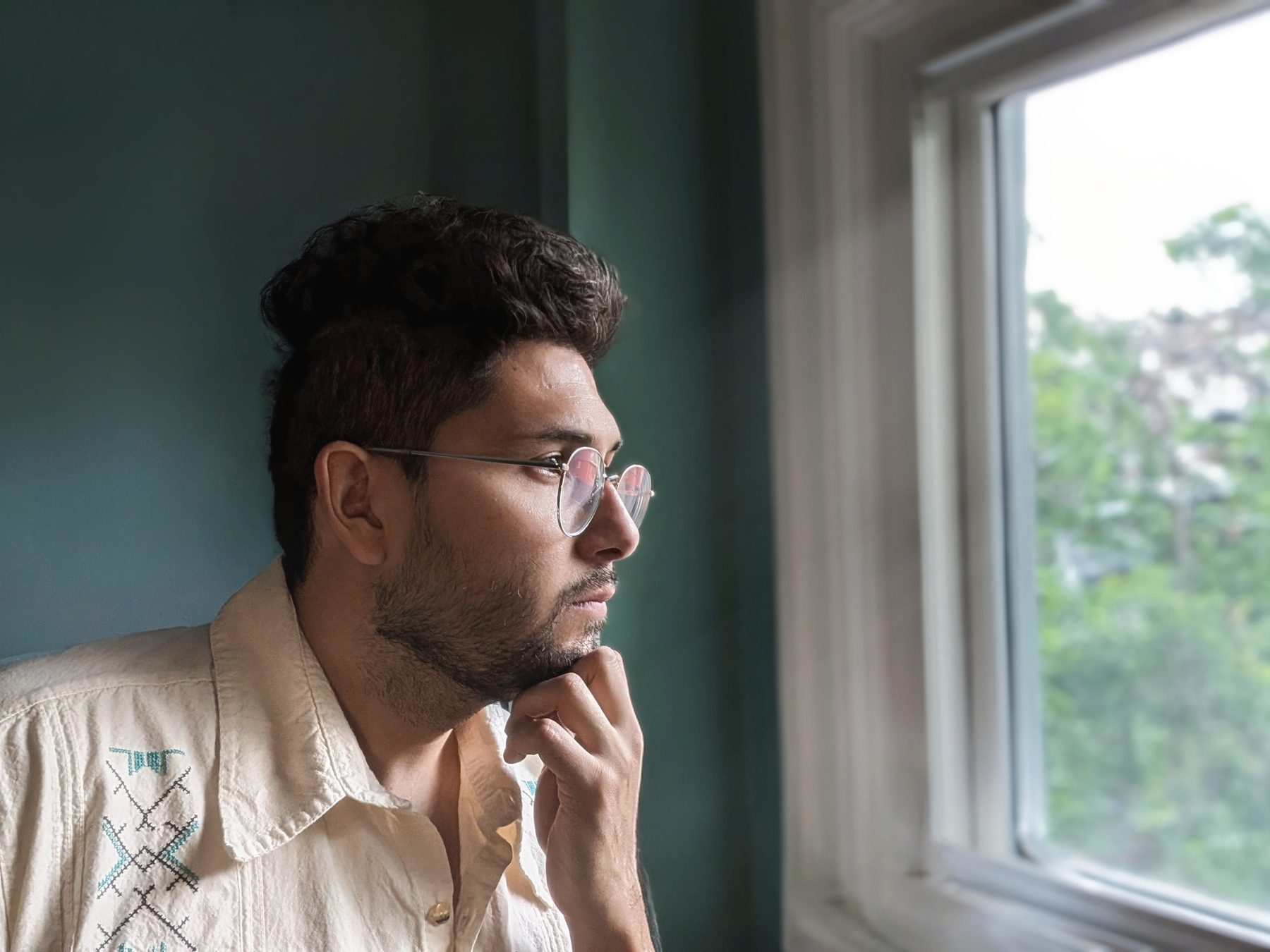 Beside a window